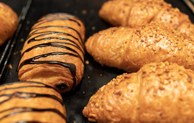 Self-service croissants in a bakery filled with chocolate