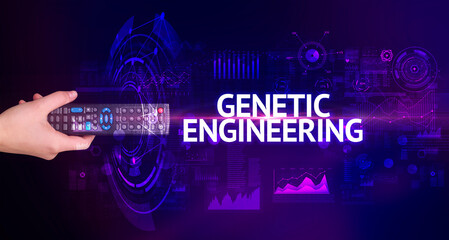 hand holding wireless peripheral with GENETIC ENGINEERING inscription, modern technology concept