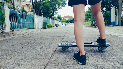 Asian girl standing on  the wave board
Asian girl step on the wave board