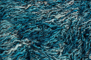 Natural sheepskin rug background. Blue sheep fur. Wool texture