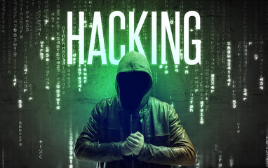 Faceless hacker with HACKING inscription, hacking concept