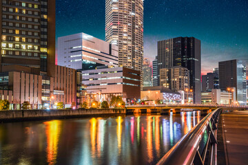 Fototapeta na wymiar Modern City of Osaka on Tosabori River at night in Japan