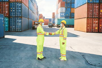 two foreman shakehand on cargo logistics container service site