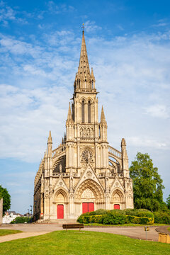 View of Basilica of Our Lady of Refuge on a sunny day. First church in France to be built in the Gothic Revival style.