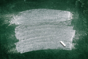 Dirty green chalkboard as grunge background