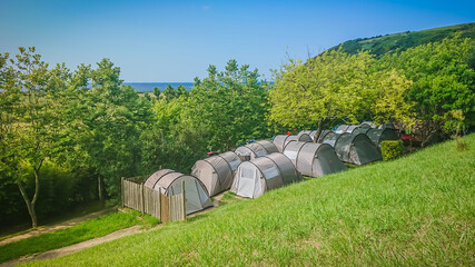 Group of tents in camping with beautiful view.