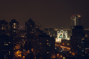 Obraz premium The night city lights. View from above on buildings. Urban atmosphere. City inspiration.