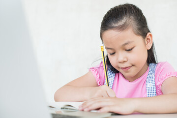 asian girl student online learning study online with video call teacher. social distance during quarantine, self-isolation, online education concept, homeschool, stay at home entertainment.