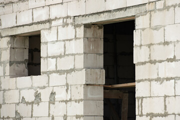 New house wall with door and window made of aerated concrete blocks
