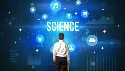 Rear view of a businessman with SCIENCE inscription, modern technology concept
