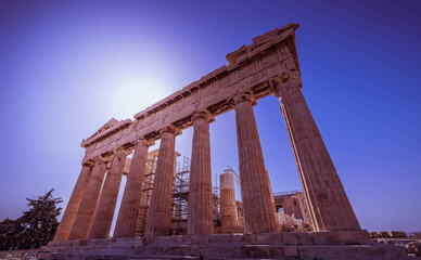 Parthenon ancient temple on acropolis of Athens under deep blue sky and direct sunlight, Greece