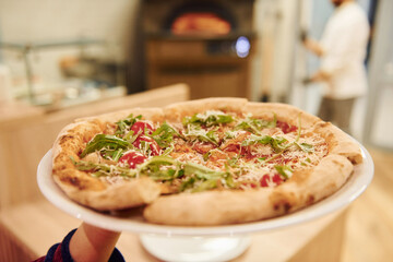 Close up view of fresh cooked pizza. Conception of food and service