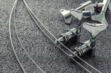 weakened by a string bass guitar with a setting device