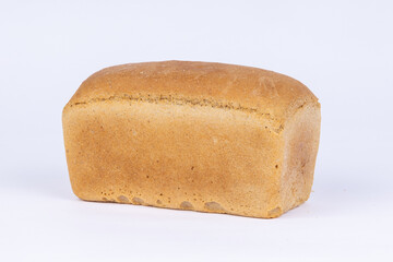 a loaf of fresh crusty bread on a white background