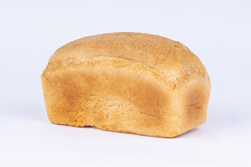 a loaf of fresh crusty bread on a white background