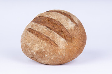 a loaf of fresh crunchy rye bread on a white background