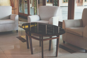 beige cushion sofa chair armchair in living room.