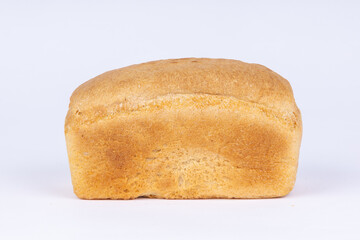 a loaf of fresh crunchy wheat bread on a white background