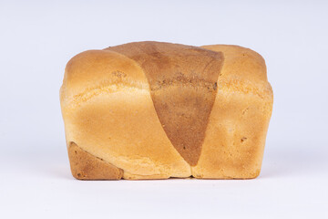 a loaf of fresh wheat bread on a white background