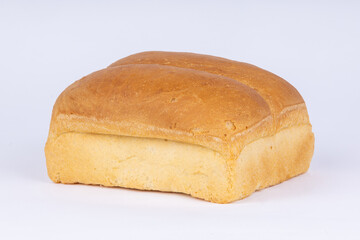 double loaf of fresh wheat bread on a white background