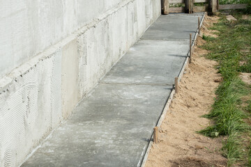 Fototapeta na wymiar Concrete blind area along the house