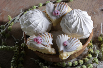 Sweet dessert with white cream and marshmallows close-up