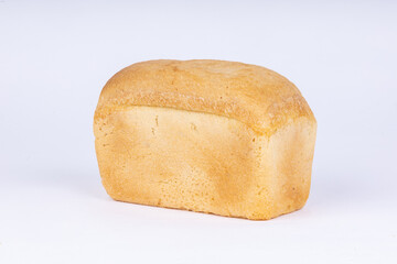 a loaf of fresh wheat bread on a white background