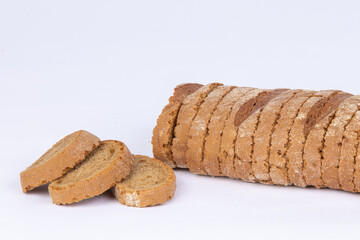 sliced loaf of rye bread on a white background