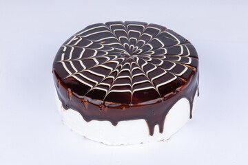 delicious cream cake with chocolate icing on a white background