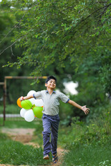 cute little indian boy with tri color balloons and celebrating Independence or Republic day of India