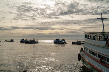 ferry and fishing boat at sunset in Koh Tao island, Thailand