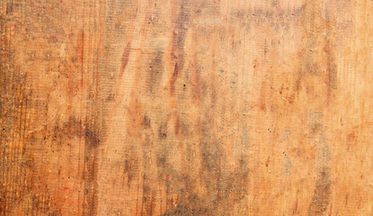 Brown scratched wooden cutting board. Abstract wood background