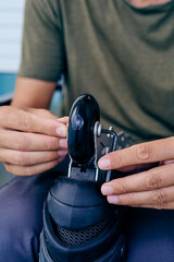 man changing the wheels of an inline skate