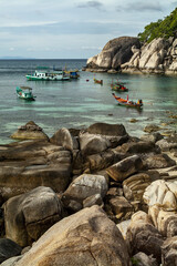 divers boat and longtail boat  in a cove of Kot Tao © hectorchristiaen