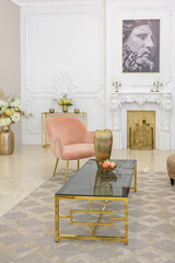 chic luxury interior in an old antique style open-plan apartment decorated with columns and stucco on the wall in pastel colors. tiles on the floor. beige walls