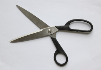 Scissors hand-operated cutting instruments. Scissors for cutting paper and thin materials, object is isolated on white background . 