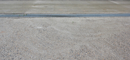 Cement mixed small gravel stone street, The Dust Texture. waterway and road after rain. 