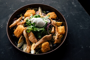 Salad served on a plate.
