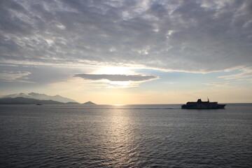 ship in sunset sea