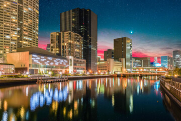 Fototapeta premium Modern Osaka city on Tosabori River at night in Japan