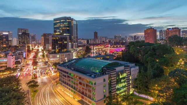 City skyline with Old Hill Street Police Station historic building in Singapore day to night transition aerial timelapse. Fort Canning Park and skyscrapers with New Bridge road on a background