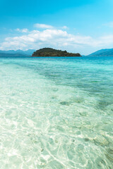 Clear water on the island,Bright blue sea and wooden boat The tourism