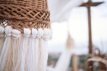 A woven macrame lamp shade that evolves in the wind. In maracans, Indian, eco-style in sand tones,...