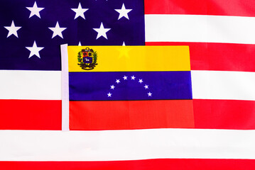 Flag of Venezuela on the American national flag, two countries with conflict between them.