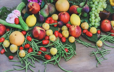 decorative composition of freshly picked fruit and flowers - concept of freshness and naturalness - pears, blackberries, figs and hydrangeas - view from above