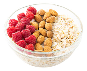 bowl of oatmeal with raspberries and almonds isolated on white background