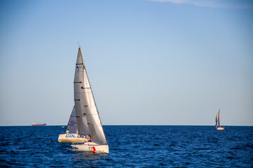 White sail on the sea. Sailing. Sailing competitions.