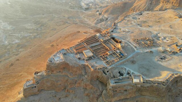 Aerial view of the ruins of Massada is fortress built by Herod the Great on cliff-top off the coast of Dead Sea. Destroyed by the Romans in the 1st century AD e. Included in UNESCO World Heritage List