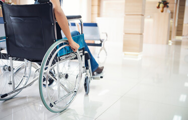 Close up asian women on wheelchair at hospital background. female patient serious sitting on...