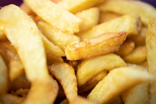 Traditional English chippy food. Chip shop chips. Fast food. Salty chips. Fried potatoes